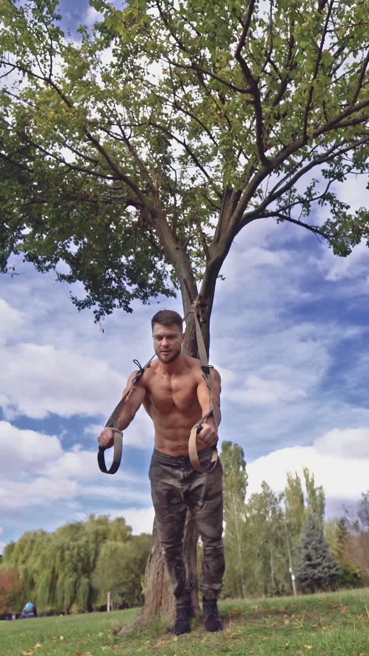 Man doing fitness exercises. Fitness man during training workout. Vertical video