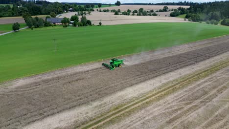 a view of efficient combined harvesting in action when the drone detects its movement and turns around the harvester