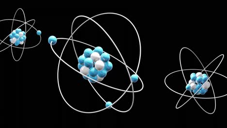 animation of atom models spinning on black background