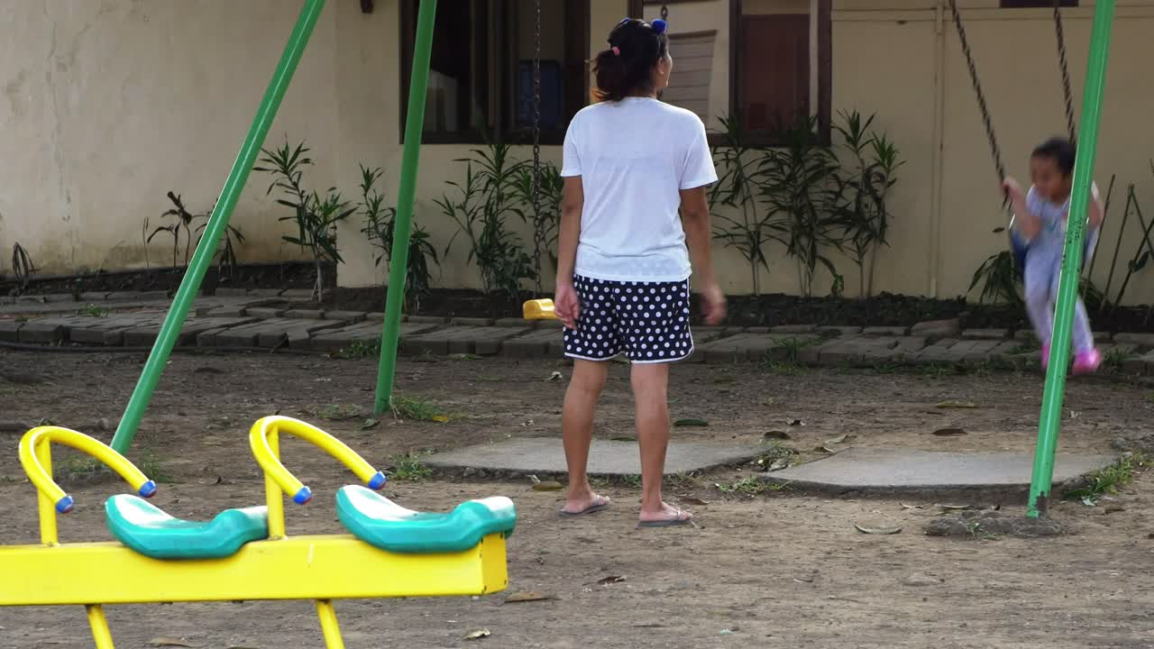 Afternoon playground scene at a suburban residential subdivision in Mandaue City, Central Visayas region, Philippines.