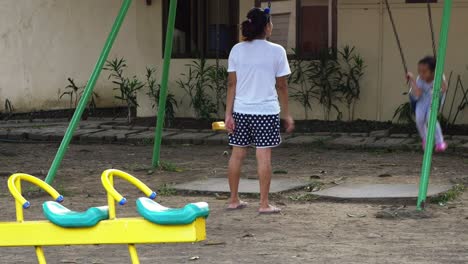 afternoon playground scene at a suburban residential subdivision in mandaue city, central visayas region, philippines.