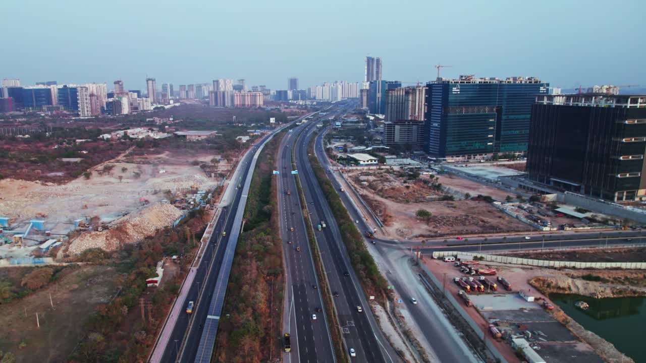 ORR with Service Road, cycle track and commercial buildings at day time, semi circle, drone shot, 4k.