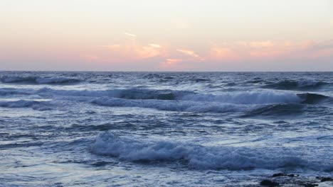 View-of-the-waves-after-the-sunset-at-Costa-Adeje,-Tenerife