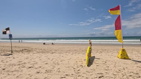 flags and beachgoers on a sunny day