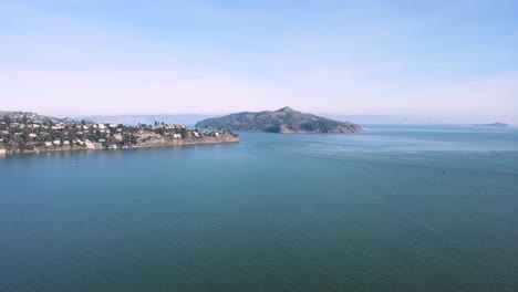 Aerial video capturing Angel Island&#039;s natural beauty, Sausalito&#039;s coastal charm, and the distant urban silhouette of San Francisco