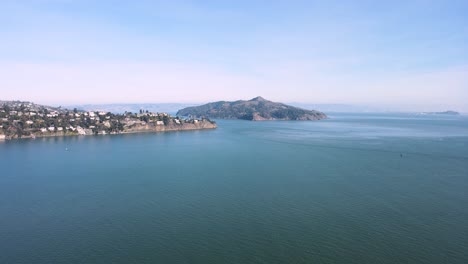 aerial video capturing angel island's natural beauty, sausalito's coastal charm, and the distant urban silhouette of san francisco