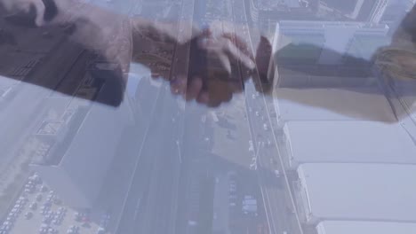 Animation-of-businessman-handshake-over-cityscape