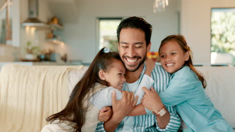 Father,-couch-and-hug-with-kids