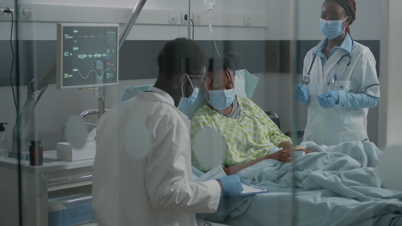 Medical team of doctors doing consultation with patient