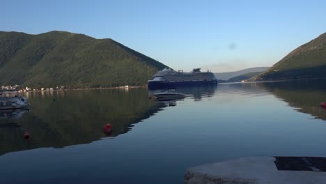 a-blue-ship-sails-through-the-bay