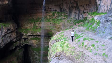 Man-Walks-At-The-Cliff-Edge-Near-Waterfalls---Balaa-Gorge-Sinkhole-In-Tannourine,-Lebanon