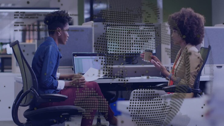 Two people discussing work at office with digital data overlay animation