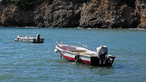 motorboats floating on the sea during daytime at jerusalem beach in greece - static shot