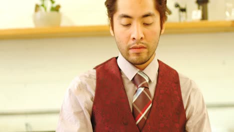 man using digital tablet kept on stand