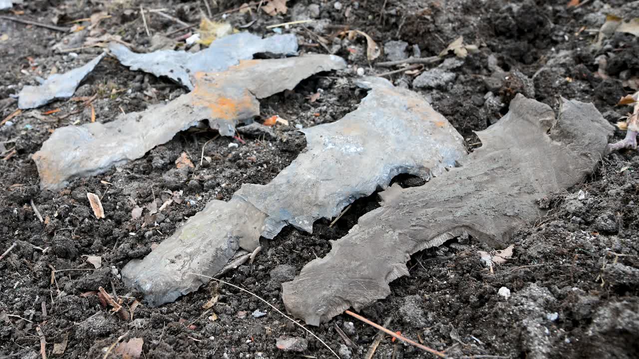 Close-up of shrapnel and missile casing debris found in a residential area on the outskirts of Kramatorsk, Ukraine. This is the evidence of a recent Russian strike on the city