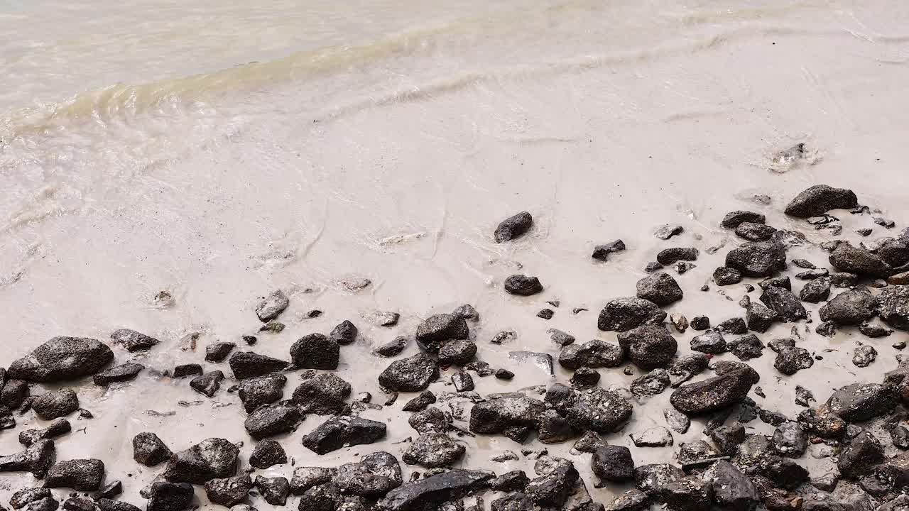 Beach with Rocks and Waves