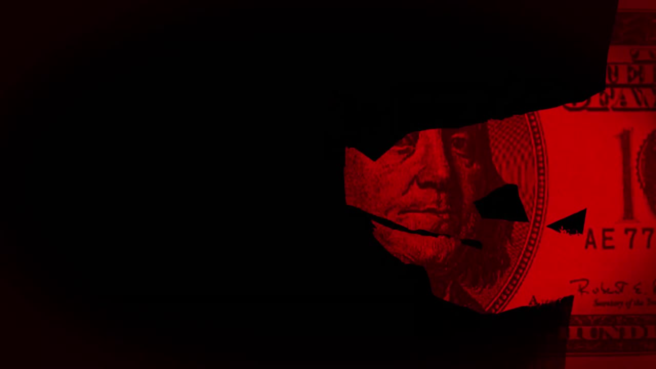 Hands counting money with red light on black background