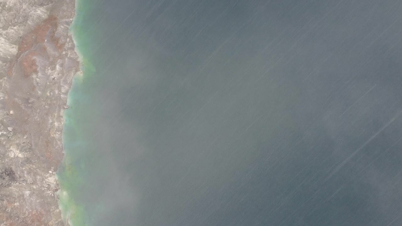 aerial shot from a plane flying over the coast of thetford mines, Quebec while its raining