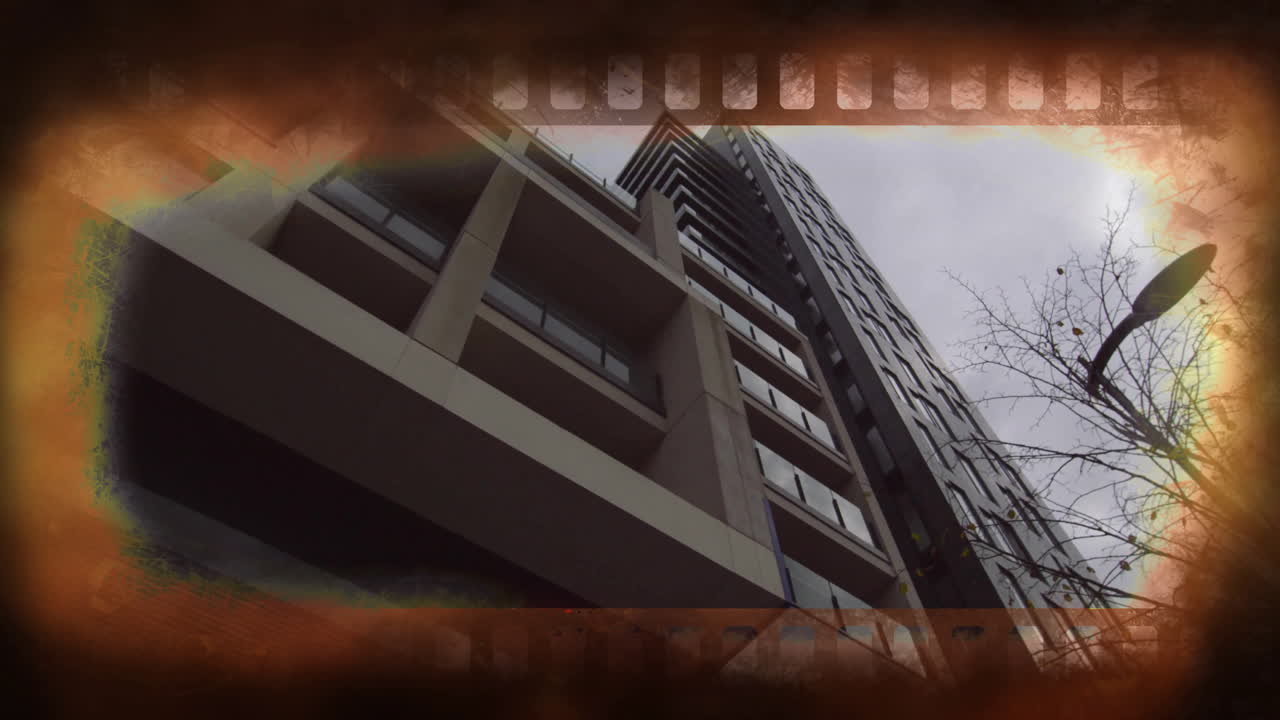Film strip animation overlaying modern high-rise building and tree