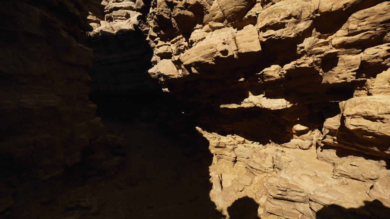 Unique rock formations in a desert canyon during midday light