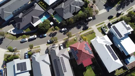 drone ascending over large family homes in an australian suburb