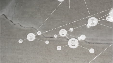 animación de la red de conexiones con iconos sobre grietas en la superficie gris.