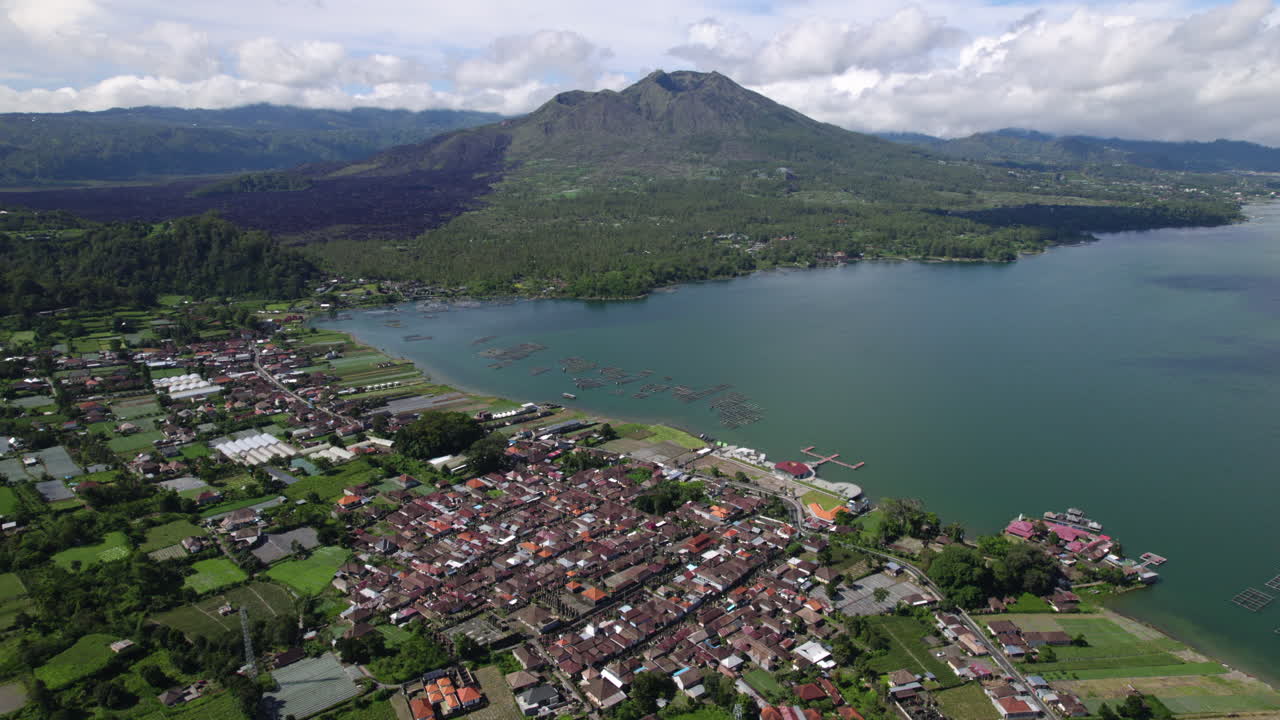 Aerial view of Mount Batur, the lake and the Dermaga Kedisan in Kintamani, Bali