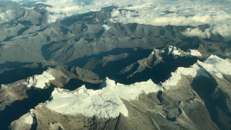 Aerial-view-of-arid-mountain-with-snow-on-its-top