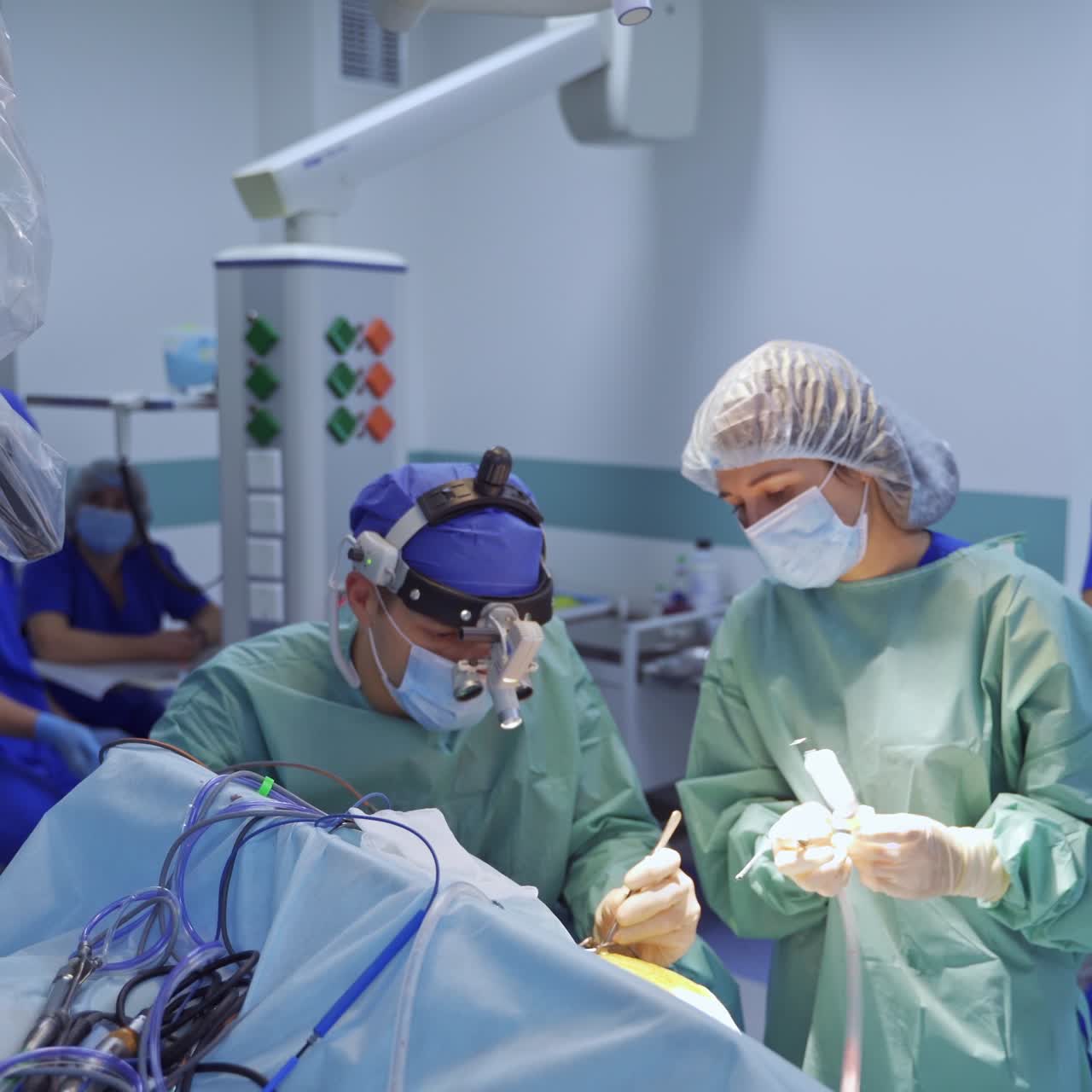 Group of professional surgeons in uniform operating. Medical specialists using instruments in operating room