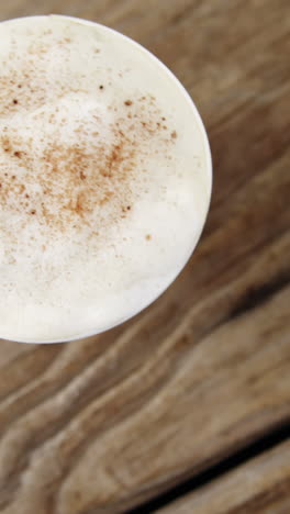 coffee cup on wooden plank