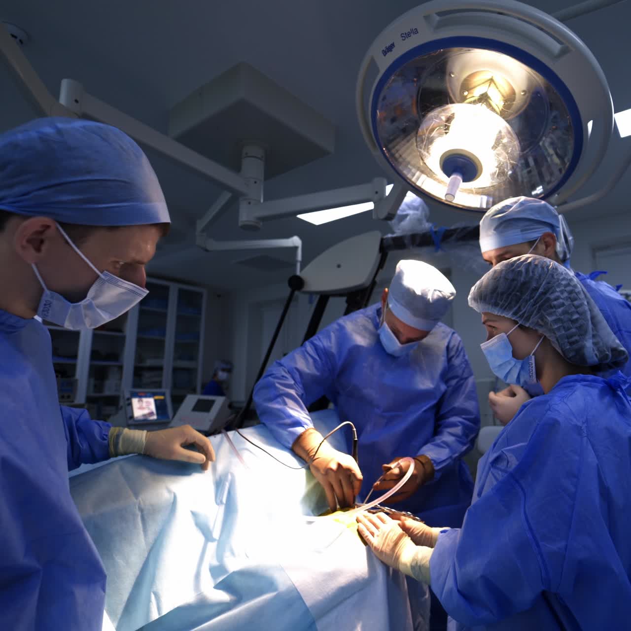 Neurosurgery specialists working in emergency room. Surgery doctors with assistant in teamwork