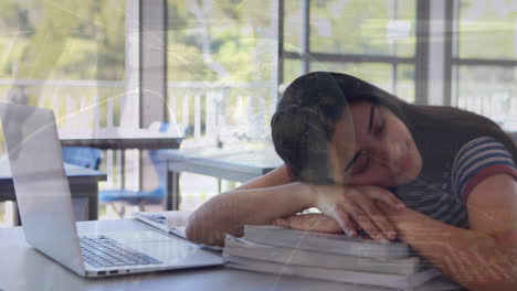 animation of financial data processing over biracial schoolgirl sleeping by laptop in class