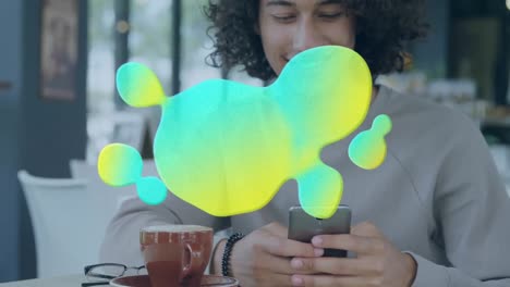 Animation-of-glowing-blob-over-man-using-smartphone