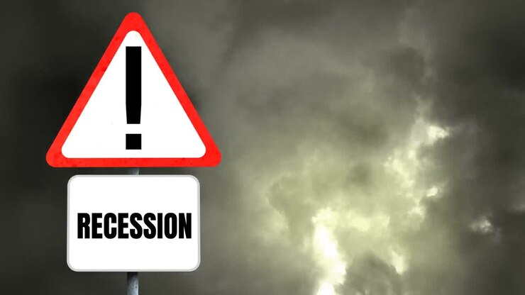 Word Recession on a triangle road sign and lightning during thunderstorm in the background