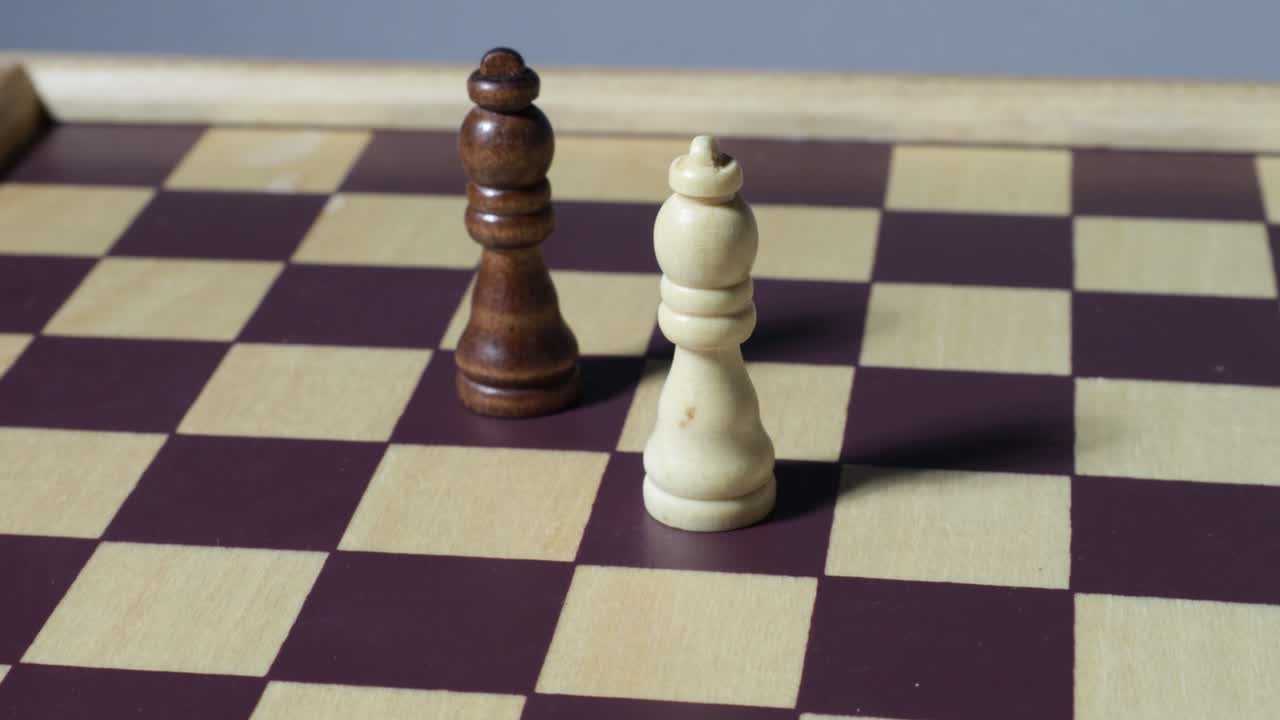Rotating cinematic shot of queens on a chessboard with shadows