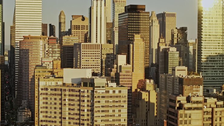 NYC New York Aerial v376 tracking drone flyover Midtown Manhattan capturing skyscrapers cityscape with golden sunlights casting on the building exteriors - Shot with Mavic 3 Pro Cine - September 2023