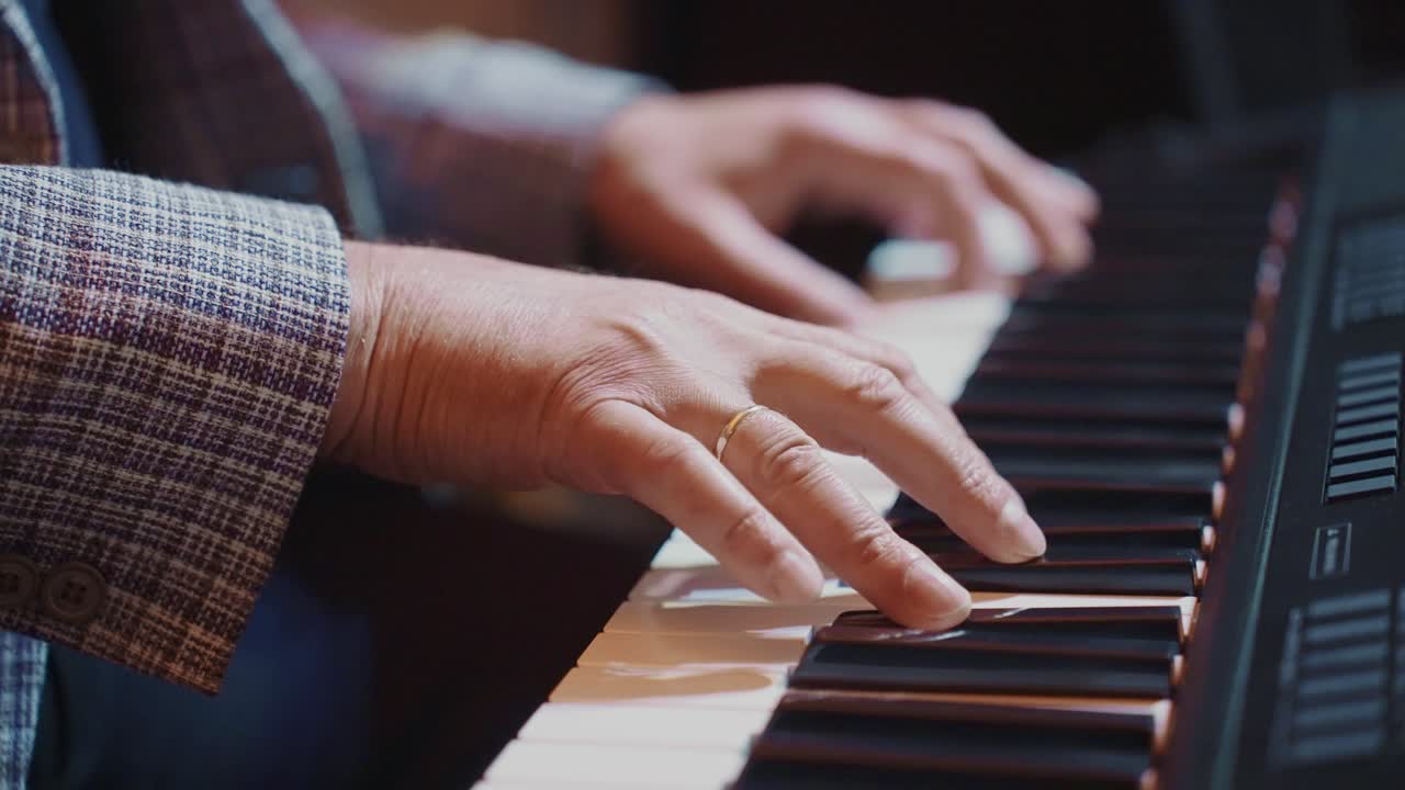 Close-up of Hands Playing a Digital Piano Keyboard