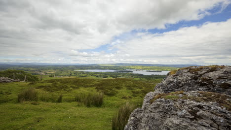 time lapse of rural and remote landscape of grass, trees and rocks during the day in hills of carrowkeel in county sligo, ireland