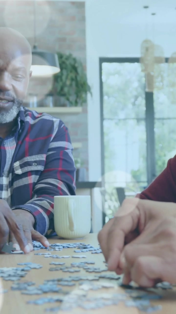Animation of spots of light over diverse senior people playing game in garden