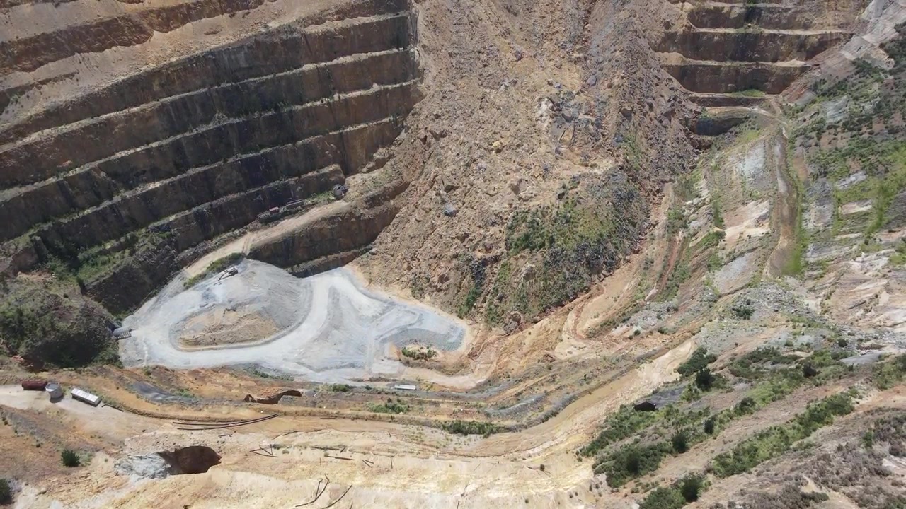 Close up flyover of the bottom of the main mine at the Martha Hill Mine goldmine in Waihi, New Zealand 4k 59.94p