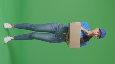 woman delivery person holding a box