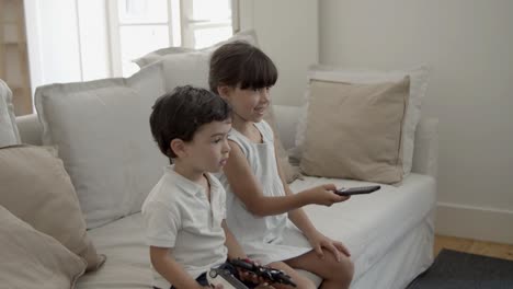 two little kids watching movie or show