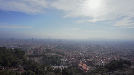 Panoramic-view-of-the-city-of-Barcelona,-Spain-on-a-cloudy-day-with-pollution-in-the-atmosphere