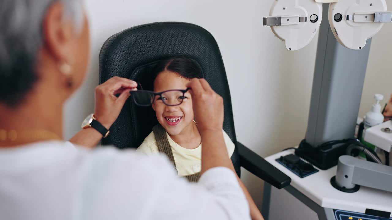 Optometrist, child and frame for glasses