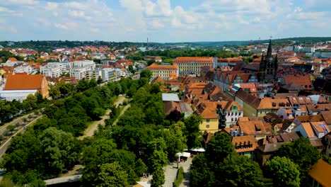4k aerial drone video of the spiers and steeples of st. johannis kirche church and kirche st. gumbertus church in ansbach, germany