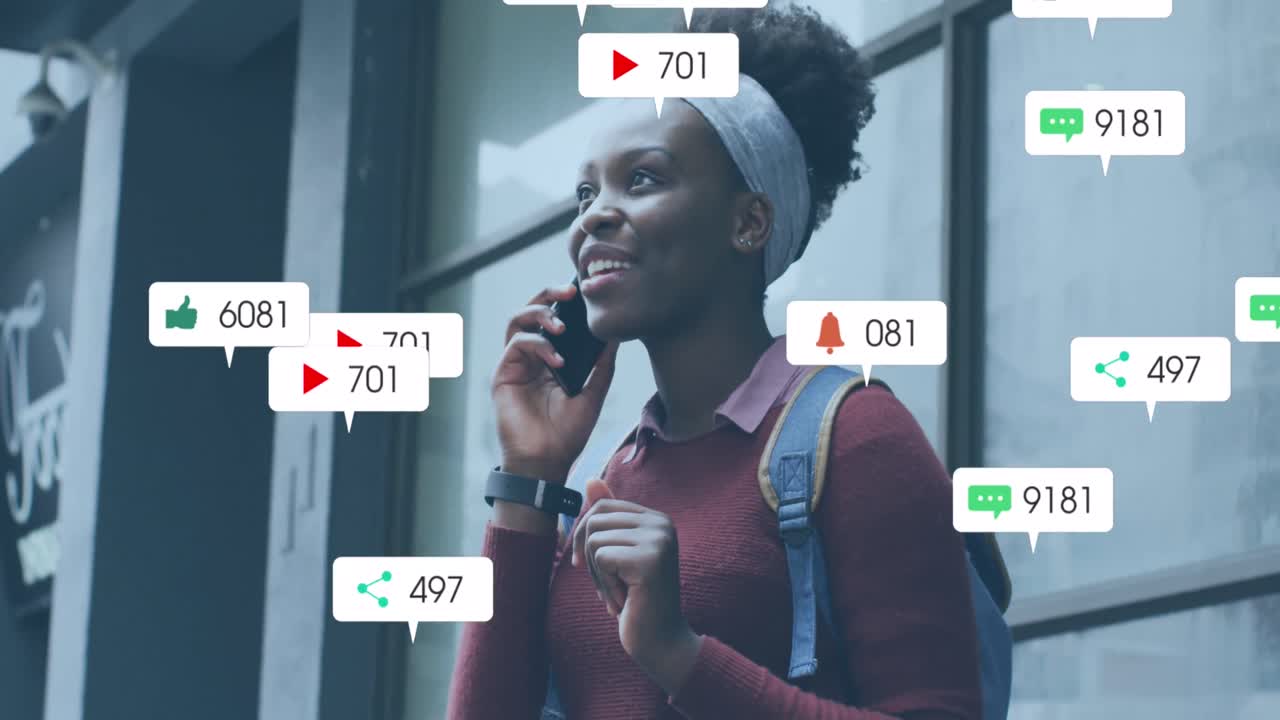 Animation of multiple social media icons over african american woman talking on smartphone outdoors