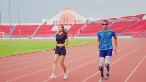 athlete with prosthetic leg training on track