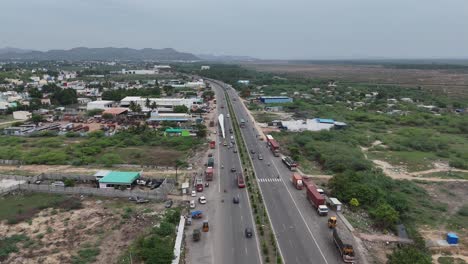 aerial view of a busy highway with vehicles and urban surroundings