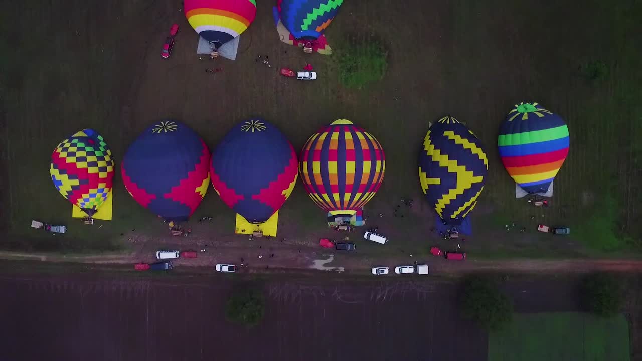 Aerial view of hot hair balloons getting ready for flight.