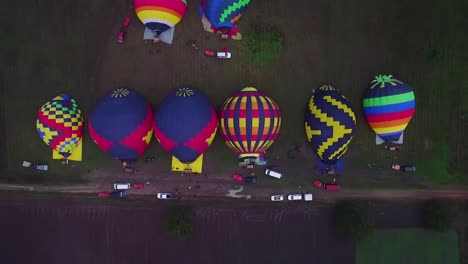 aerial view of hot hair balloons getting ready for flight.